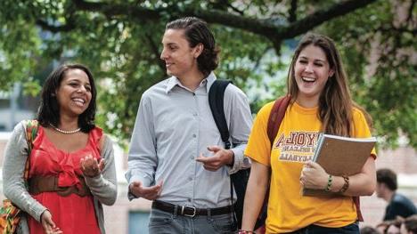 Students walking on campus having fun.